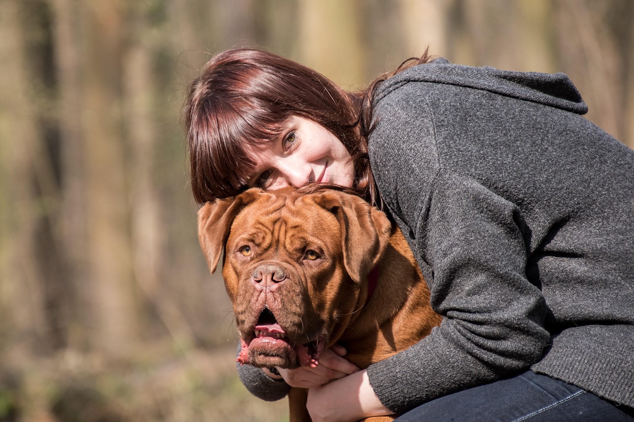 Owner getting along with her dog that waits for her patiently at home